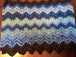 The temperature scarf for the month of January with a sc ripple stitch.